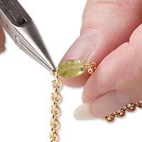 Pliers connecting a beaded loop to chain